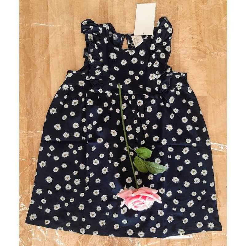 Children's dress with small white flowers with frills