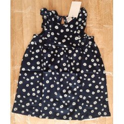 Children's dress with small white flowers with frills