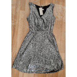 Sleeveless ladies dress with silver colored sequins