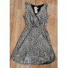 Sleeveless ladies dress with silver colored sequins